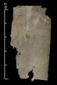 Fragments of paper and textile found with Qing period document. Some have Chinese text.