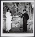 Photograph of Raghu Vira with an artist from the Dunhuang Institute in cave 445 taken in 1955.