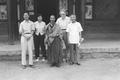 Photograph taken by Joseph Needham between 12-17 July, 1958, on his visit to Mogao, Dunhuang, showing (l. to r.) Chang Shuhong, Lu Guizhen, Yi Changshu Lama, Joseph Needham, Liu Rongzeng in the office building