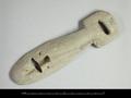 Wooden buckle with a square head and a long tongue-shaped piece. Both parts have an oblong hole, the tongue-shaped piece additionally has a hinge-hole for a tongue with which a strap would have been fastened. The object was probably part of a horse-harness.