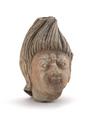Stucco head of a male figure depicted with a fierce facial expression and with hair brushed straight up. The hair was painted black and the face red.;