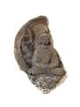 Clay relief plaque showing the Buddha seated in meditation on a lotus calyx. Traces of paint remain.;