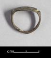 Bronze ring with an incised decoration on the bezel. It is a linear design set within a circle.