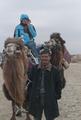 IDP Field Trip: Camel journey from Daheyan to Karadong (Rachel Roberts and camel man), 18 November 2011.