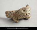 Fragmentary saucer in the shape of a hedgehog. The remaining part shows the head and the forefeet. The body is decorated with incised lines forming a lozenge-pattern.;