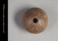 Spindle-whorl made of fired clay. The object is decorated with four incised lines which have small leaf-shaped impressions to the right and left.