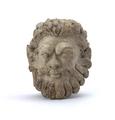 Fragment of a stucco figure. This is the head of a male person, with a fierce expression and the hair brushed back. He has long and wavy hair and a beard formed by a series of curls. The head was made using a mould, while the curls of the beard were moulded and applied separately. Traces of a white slip and the brown paint used to colour hair and beard are still visible. For faces made using the same mould see MAS.1036, MAS.1040 and MAS.1041.;