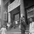 Picture of Irene and John Vincent's eldest daughter in front of a theatre in Tianjin, 1949.
