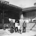 Picture of Irene and John Vincent's two children and the servants in Beijing, 1949.