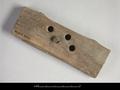 Wooden lock. This is the tumbler block of a lock with four holes in total, drilled in two lines of two. For the second part of the lock see MAS.511b.
