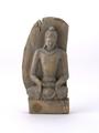 Figurine of a Buddha seated in meditation on a square stall against an oval mandorla. Carved in wood and bearing traces of paint.;