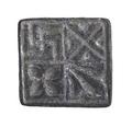 Square bronze seal with a small loop-shaped handle. The base of the seal is divided into four equal squares, decorated respectively with a quatrefoil, a swastika, a diagonal cross and a fleur-de-lis.;