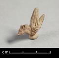 Fragmentary clay figurine of a bird. The animal sits on a stand but is shown with spread wings as if flying. Parts of the beak and the crest are missing. Details such as the feathers were rendered using incised lines.;