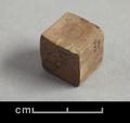 Wooden die. The pips have been painted using ink which is very faded.