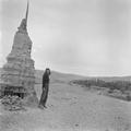 Photograph of the Dunhuang Mogao Caves with Irene Vongehr Vincent next to stupa in 1948.