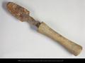 Iron tool, possibly a chisel, with a wooden handle.