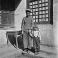 Jamini Vincent and postal clerk en route to Jiuquan, China, taken by Irene Vincent in 1948.