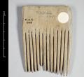 Wooden comb with a rectangular top. The teeth are widely spaced and square.;
