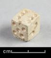 Small bone die with incised round pips.