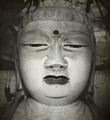 Photograph of Buddha head in Dunhuang Mogao cave 96 taken by Desmond Parsons in 1935.