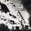Photograph of the cliff, chapels and the Nine Storey Buddha at Mogao Caves, Dunhuang, taken by Irene Vincent in 1948.