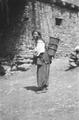 Tibetan woman carrying water.