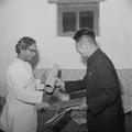 Photograph of Chan Shuhong presenting gifts to Raghu Vira at the Dunhuang Institute taken in 1955.