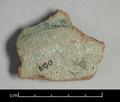 Bottom sherd of a vessel made of coarse red clay. The green, all-over glaze is very worn and the original colour impossible to determine.