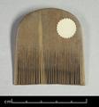 Fine-toothed wooden comb with a strongly arched top. It is in very good condition and none of the teeth have broken off.