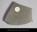 Sherd of a vessel made of medium grey clay. The decoration consists of impressions of textile on the outside. These are interrupted by horizontal lines.