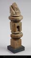 Fragment of a wooden baluster. The object is divide into three cubical parts separated by a pair of triple mouldings.
